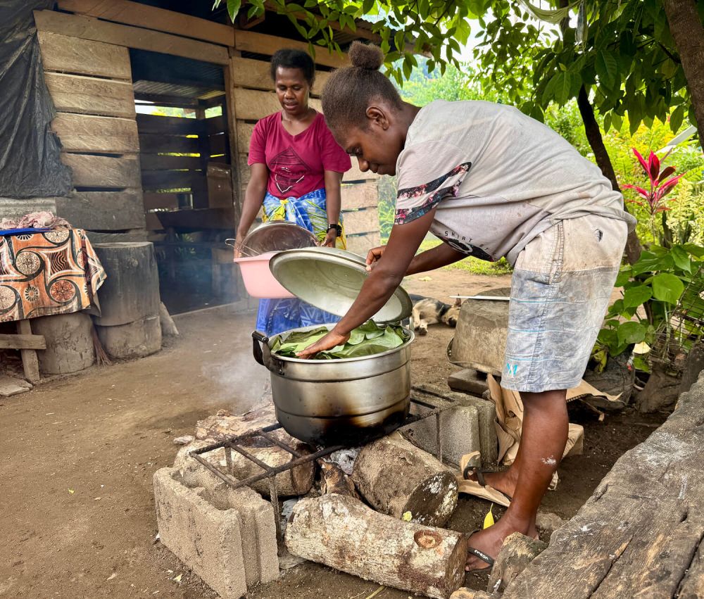 (Left) Elizabeth, a leader at the local Salvation Army and Genevie cooking a communal meal in the earthquake&rsquo;s aftermath.