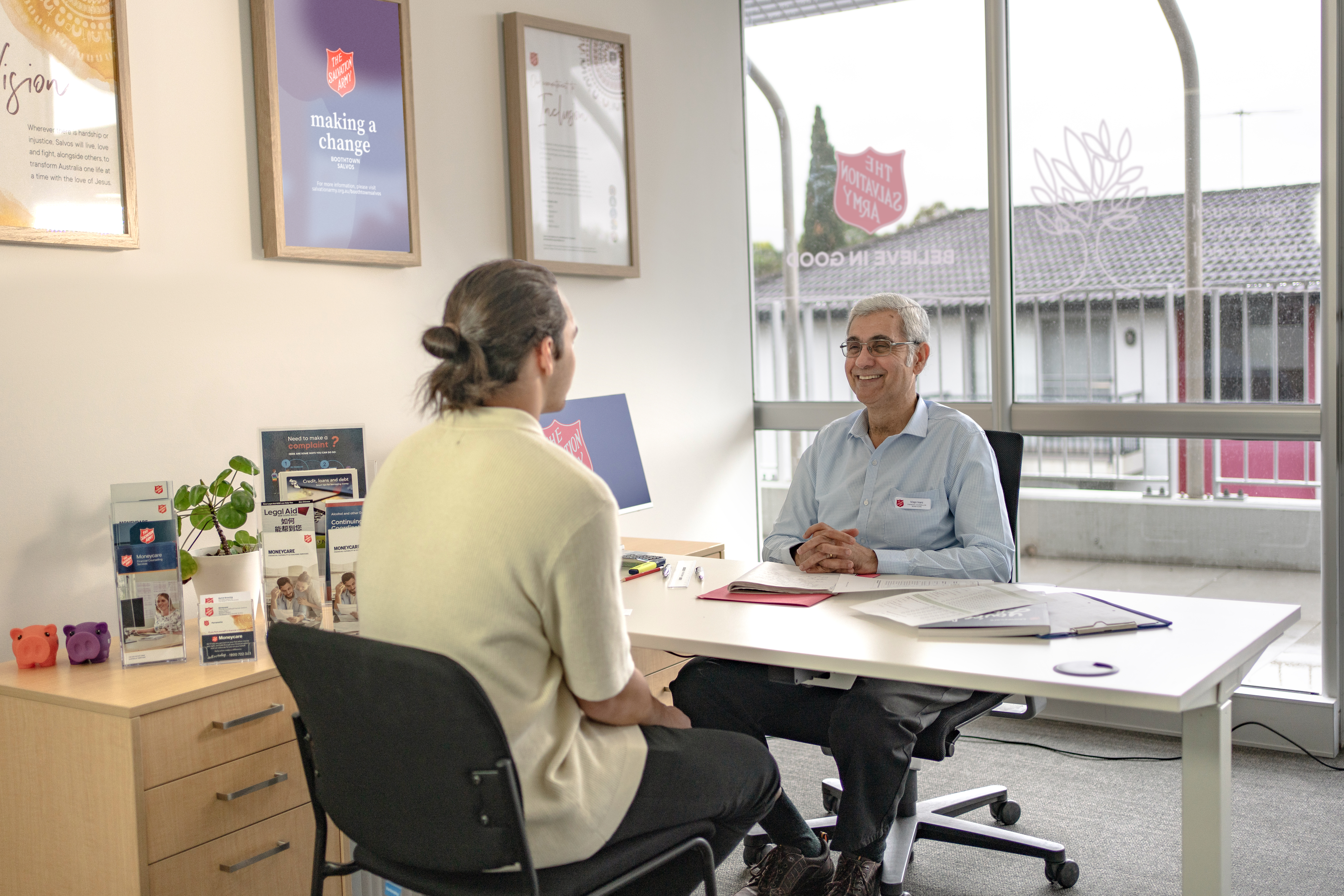 A Moneycare financial counsellor and their client. 