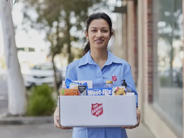 A woman holding a hamper.