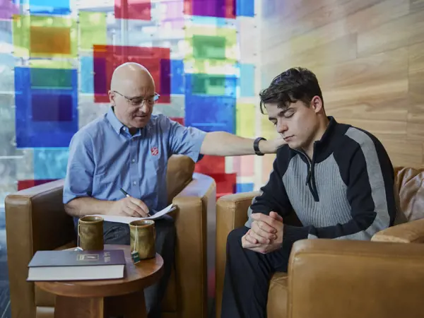 Employee offering support to a young man