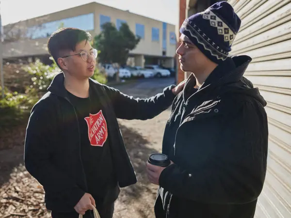 Salvos team member helping an individual