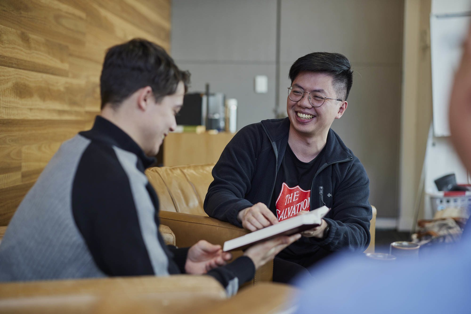 Volunteer smiling with young person